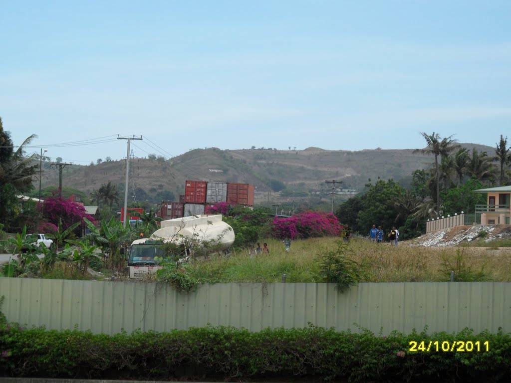 View looking back up to Hills above HOHOLA area from Motor Vechile Building in Kunai Street, New Road cut over Burns Peak Hill at top, Port Moresby, on 24-10-2011 by Peter John Tate