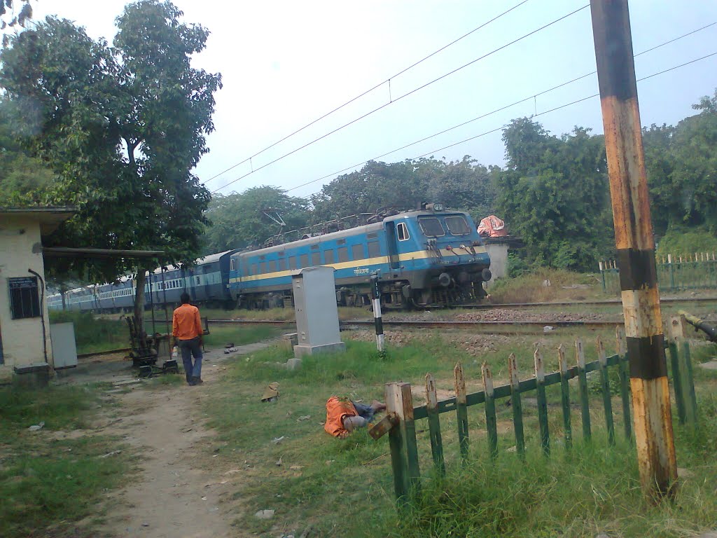 Train at Brar Square crossing New Delhi by suchitaxaxa