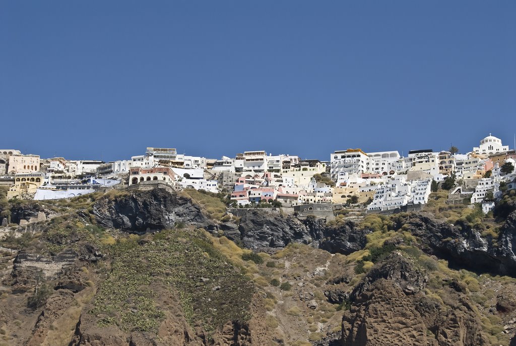 Thira sitting atop the lava walls of the caldera by Fred Henstridge