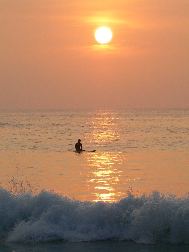 Surfing at sunset by epicure