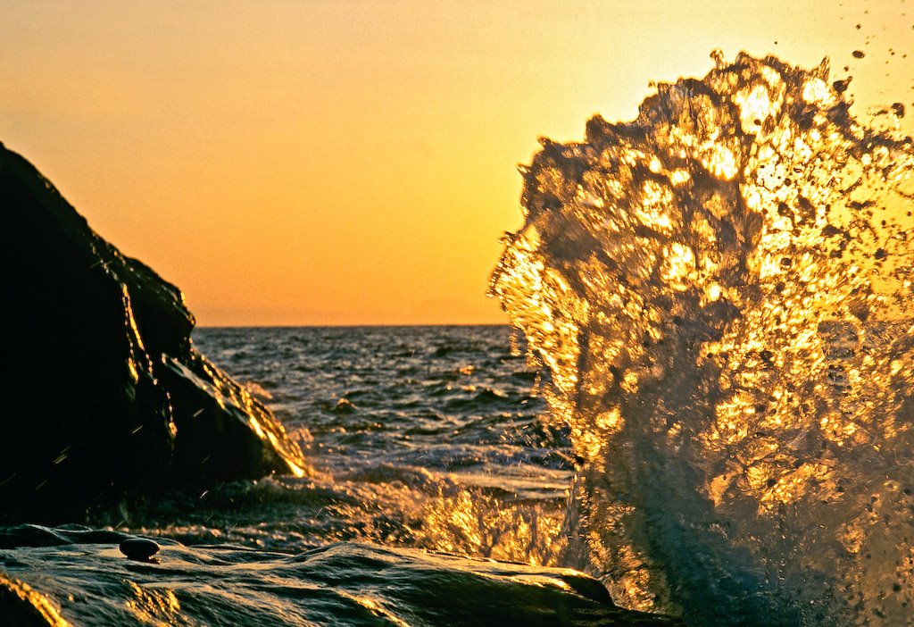 Waves crashing on a beach at dusk in north Crete, Greece by George Messaritakis