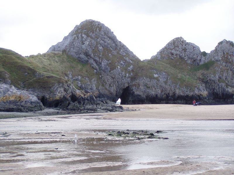 Three Cliffs from north side, showing archway through the cliffs. by Stephen John