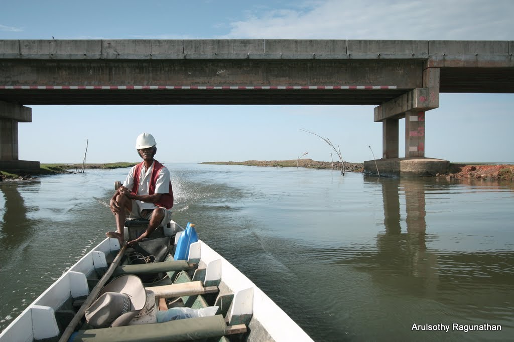 Heading back, under elevated road. As indicated by depth markings, the base of the span under the canal is about 5 meters off present water level which can rise with the raining season. Thale Noi Waterfowl Reserve, Khuan Khanun District, Phatthalung Provin by Arul KL