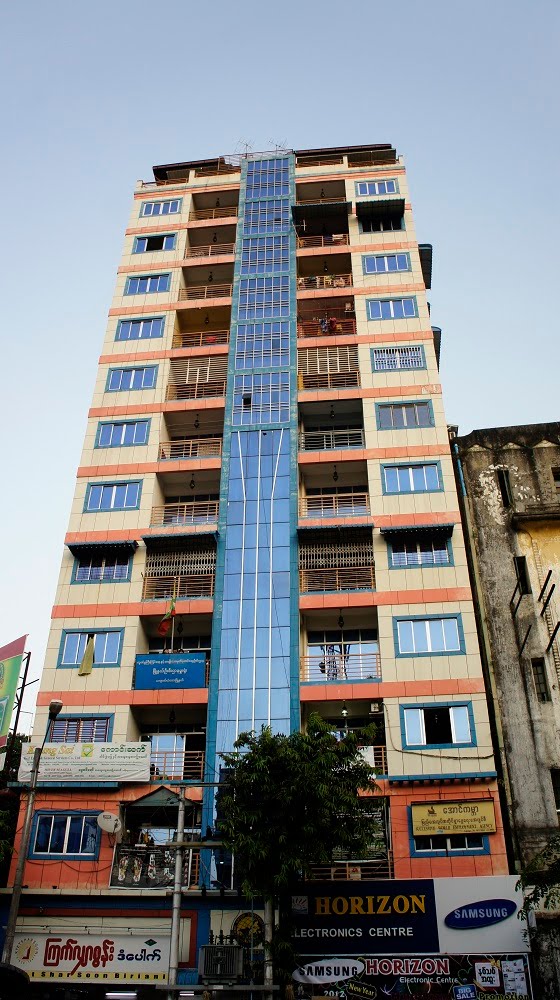 Colourful high rise on Pansodan Street, Rangoon by Paul HART