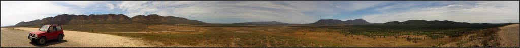 Pugilist Hill Lookout - showing Wilpena Pound (centre right), Elder Range (distant centre), Chace Range (left) and ABC Range (right) November 2011. Peter Neaum. by Peter Neaum