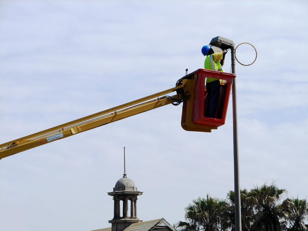 Installing Christmas lights. Swakopmund by Fanie Gous