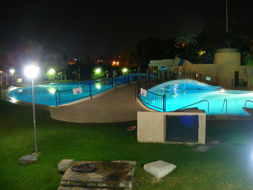 Swimming pool by night by Tony Bradbury