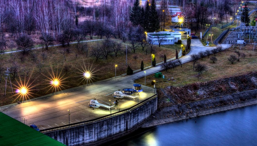 Helicopter landing place. The storage reservoir dam in Solina. HDR The Solina Dam (Polish: Zapora Solińska) is the largest dam and hydroelectric plant in Poland. It is located in Lesko County in the Bieszczady Mountains area of south-eastern Poland. The by Dawid.Martynowski