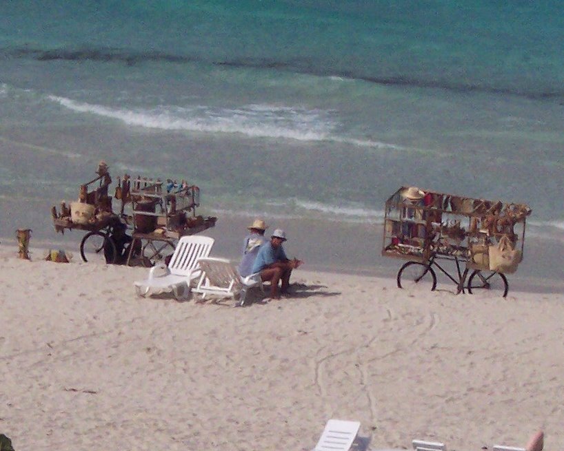 Trinket Traders Looking for Customers on the Beach in Varadero by Mel Monahan