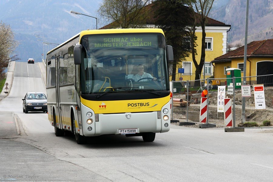 Postbus arriving in Jenbach, passing the Zillertalbahn station. by 21c123