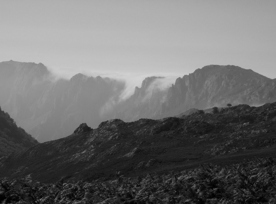 Clouds spilling over ridge, Picos de Europa by Ben Dunster