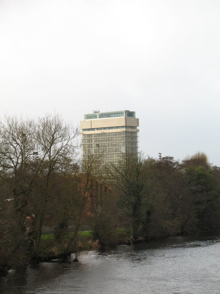 A tall building near River Lee by Sebastian “sebrem” B…