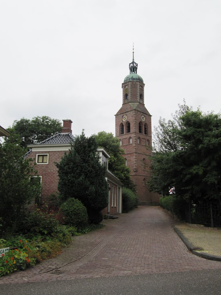 View through the Kerkstraat on the Hervormde kerk by Willem Nabuurs