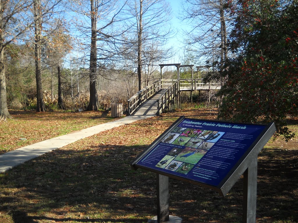 Wetlands sign with the deck in the background. by Rob77059