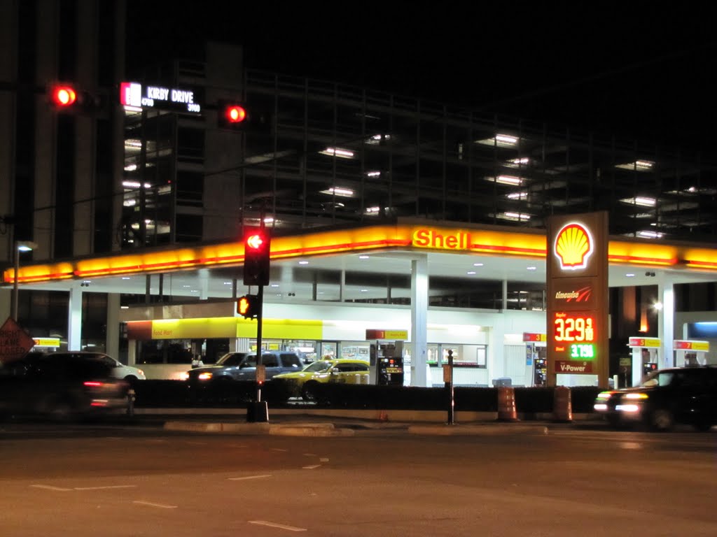 Shell Gas Station at NW corner of Kirby Dr and SW Fwy 59 (at night) by Wolfgang Houston