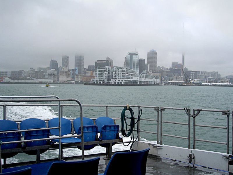 Auckland's skyscrapers scraping clouds. by Bill Edwards