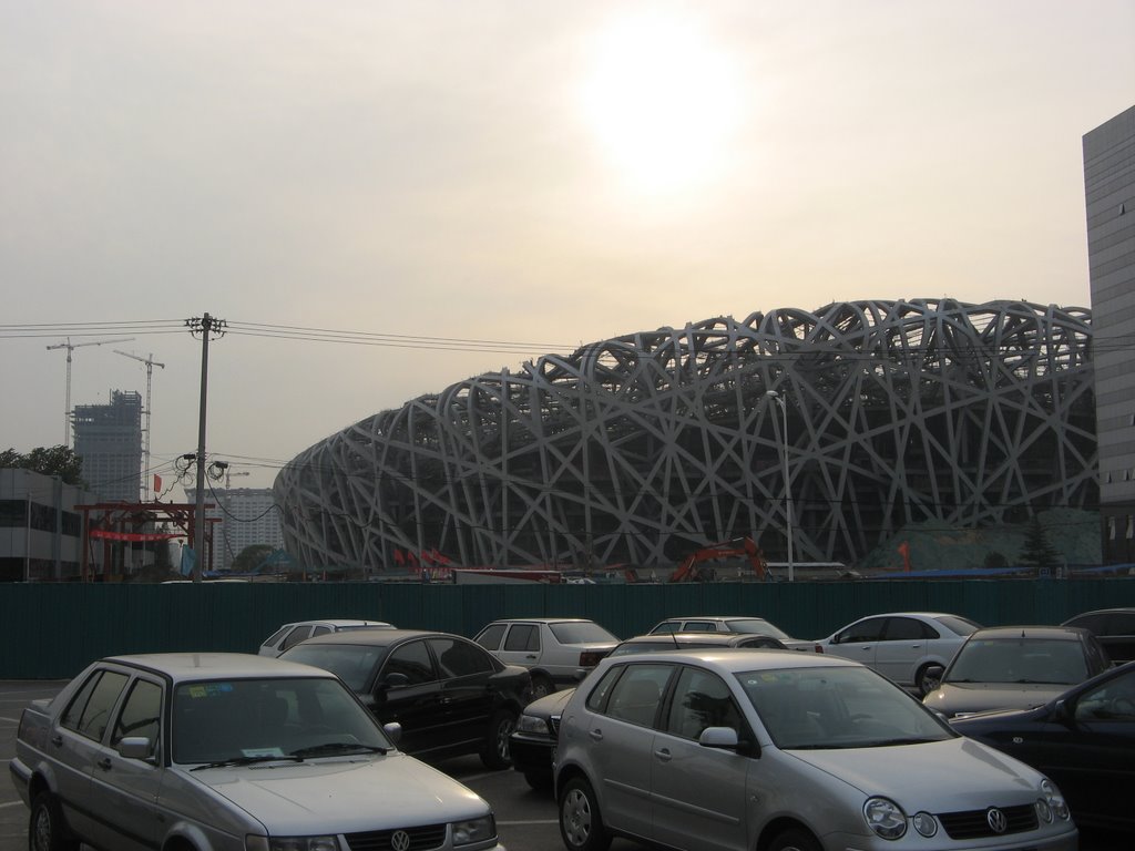 China, Beijing, Construction of Olympic Stadion at sunset by MCSTechcon