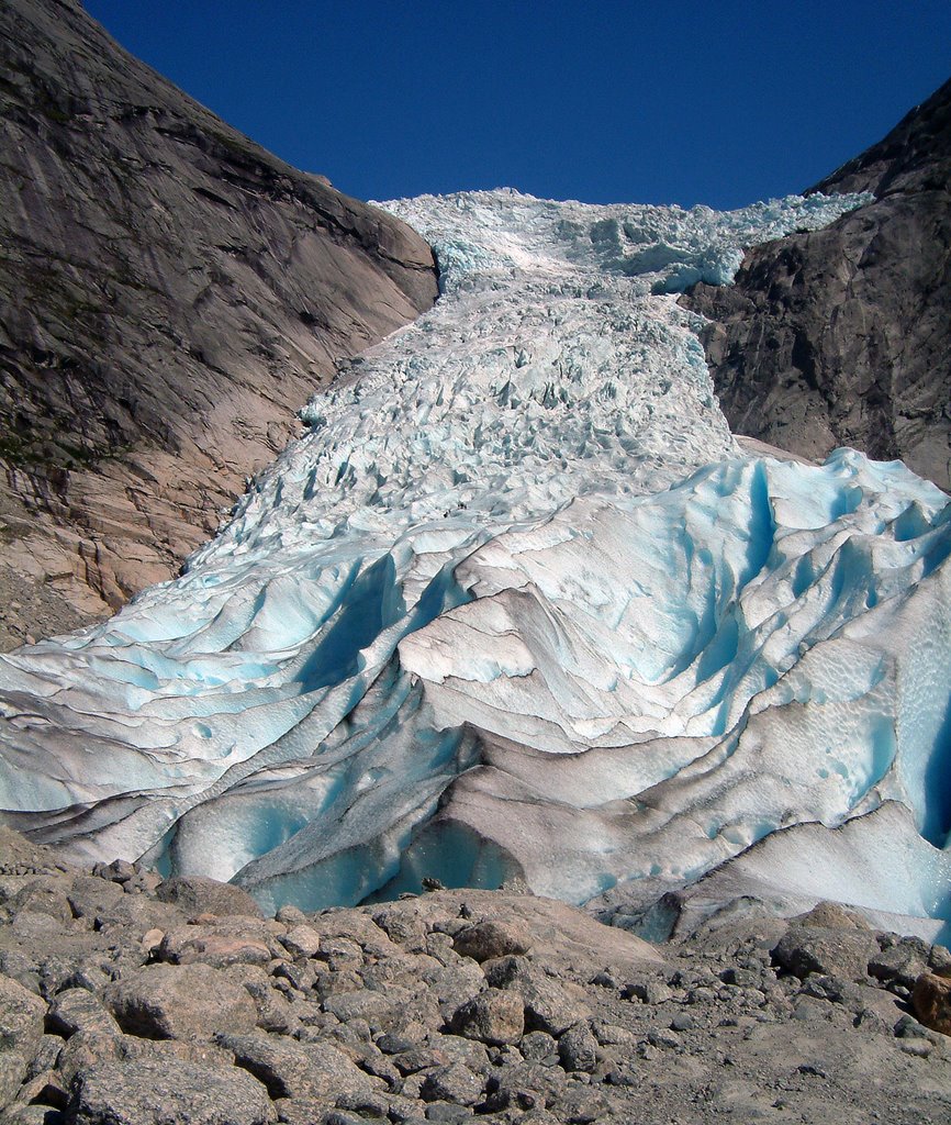 The receding edge of Briksdalen glacier, look for the hikers. by Paul Sorensen