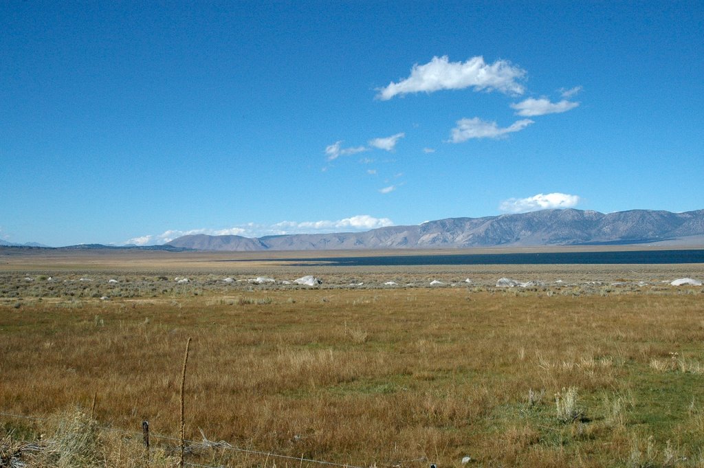 U.S. 395 in California. Looking across Crowley Lake and Long Valley in a northwesterly direction with the Glass Mtns in the background. by Mike McDonald