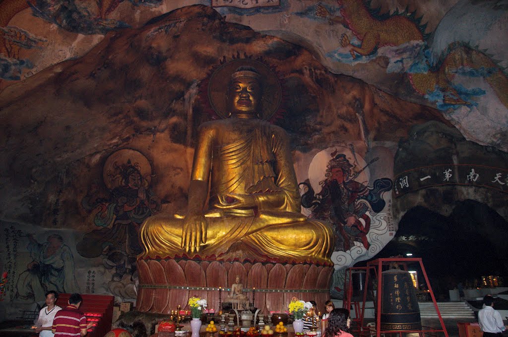 Golden Buddha statue and murales inside Perak Tong in Perak, Malaysia. by Nicola e Pina Malaysia 2011