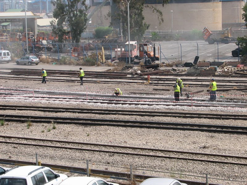 Haifa, Maintaining works in the train's railway, Haifa East railway station, Israel by Kobi Zilberstein