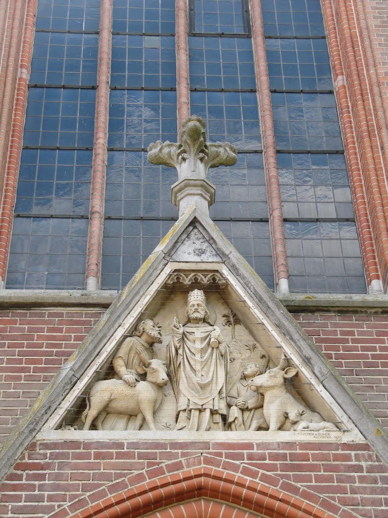 Relief of Saint Cornelius above the entrance of the Sint Corneliuskerk by Willem Nabuurs