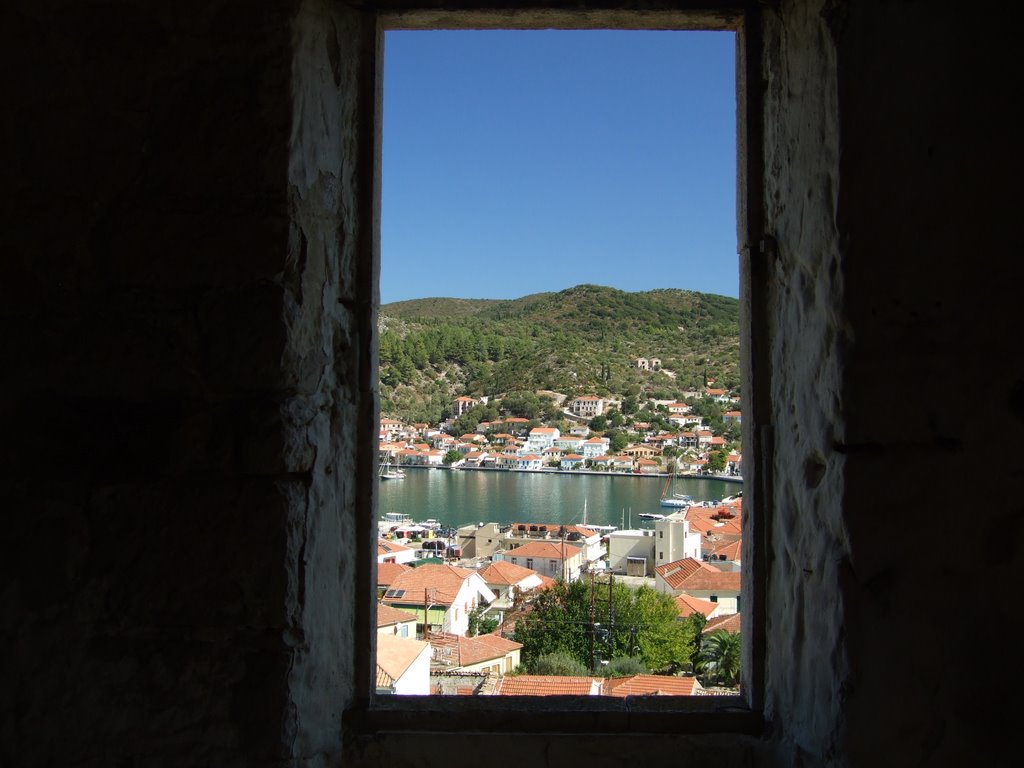 Vathy through window of an old house by vladopal