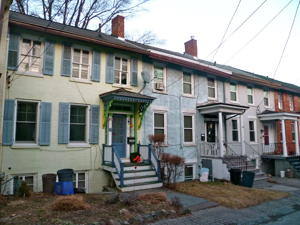 Attached houses with raised basements by Mark Caro Yallum