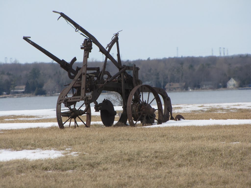 Old farm implements are everywhere on historic Amherst Island. They give a quaint feeling to the whole island. Enjoy them on your visit, by Steve Manders