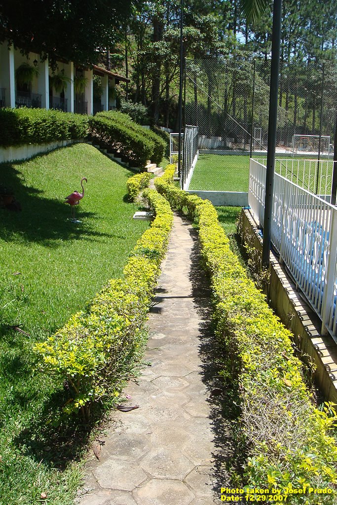 Passway to the soccer field by Josef Prado