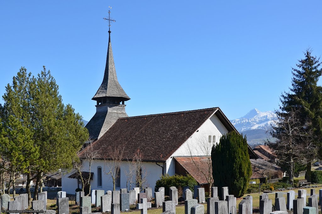 Region of Lake Thun: church and cemetery in the village of Reutigen by kurt.fotosuisse