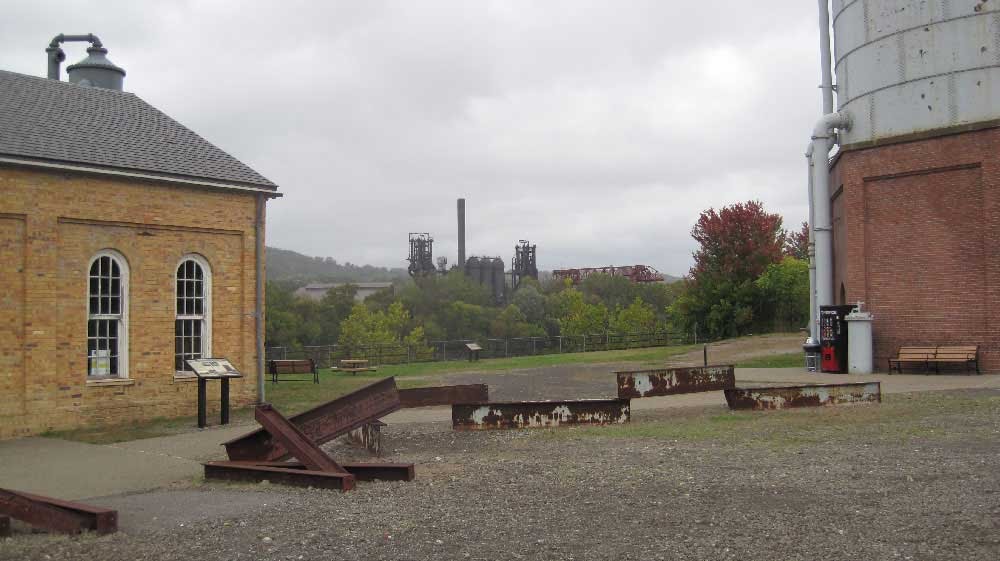 Pump House and Water Tower with Carrie Furnace in the distance by pyrotopia