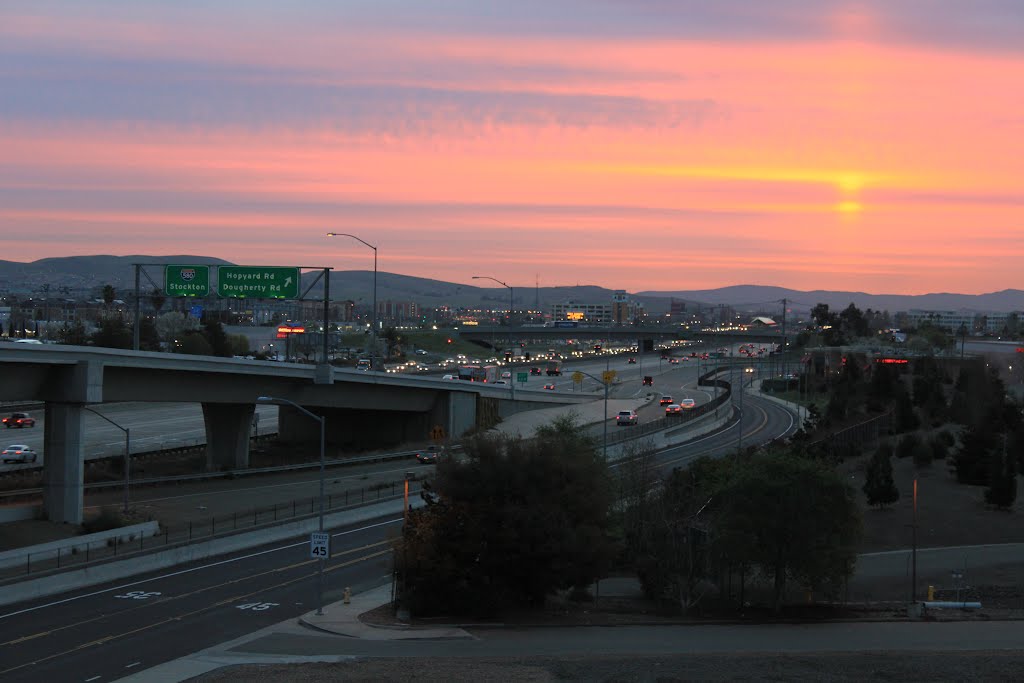 Sunrise sun pillar over I-580 by Brian Zurita