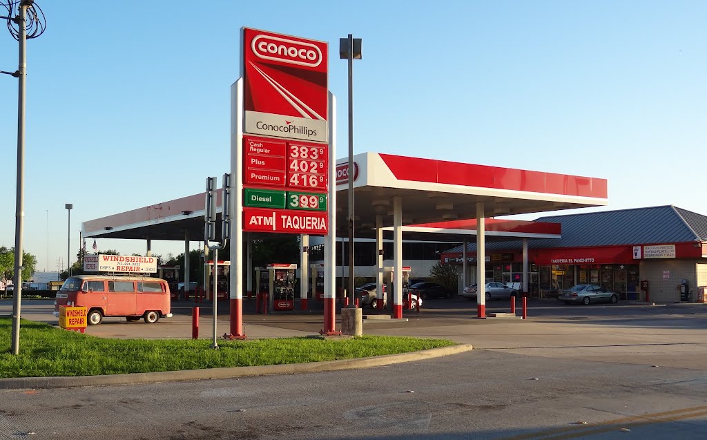 Conoco gas station on SH6 at intersection with Memorial Drive with vintage "VW Bus" (putative foreign ancestor of modern-day minivan) on the premises by WOLFGANG HOUSTON WEST