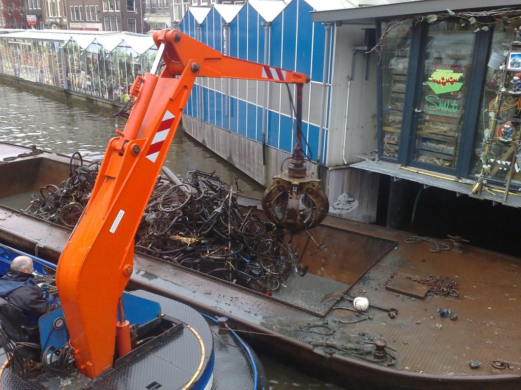 Old bikes out of the channel's water by Julian Manov