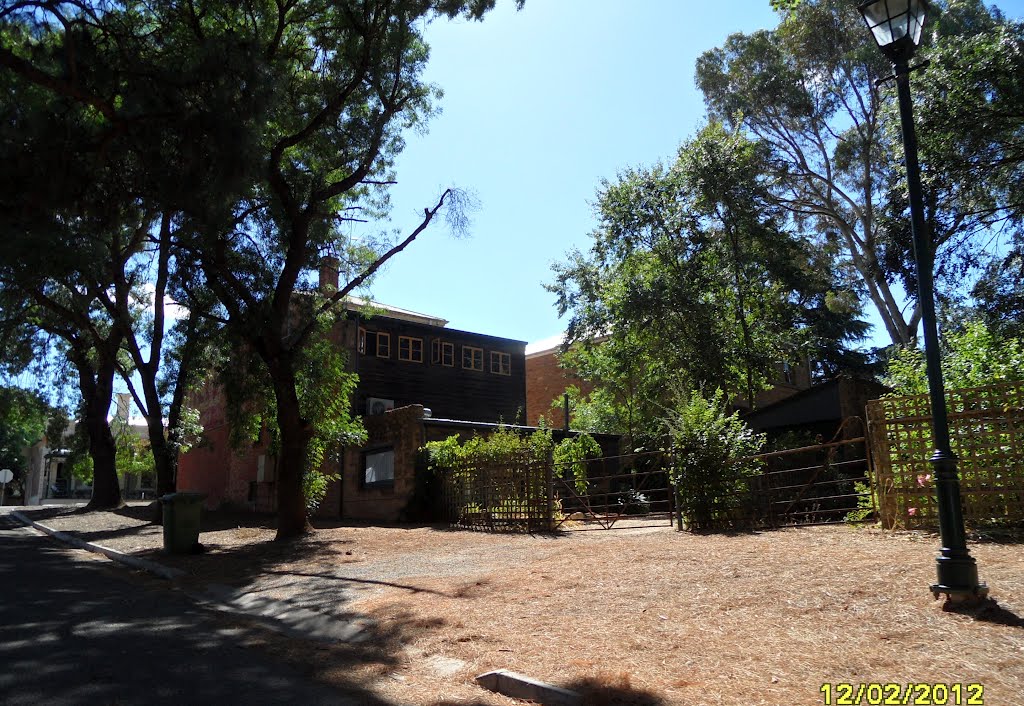 Back area of old 2 story Stone Building along Church Street, used by ERIN-EYES WINES, in AUBURN, on 12-02-2012 by Peter John Tate