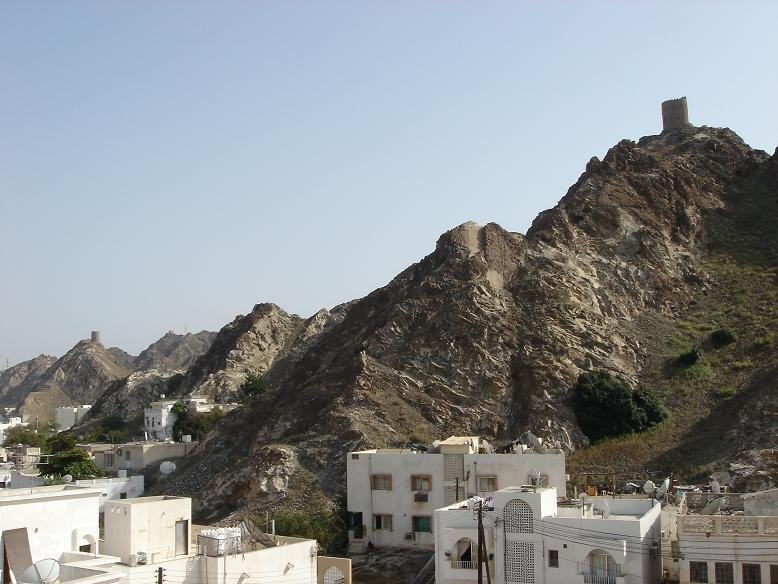 Rocky Relief with old Fortification Towers in Muscat by patrique3000