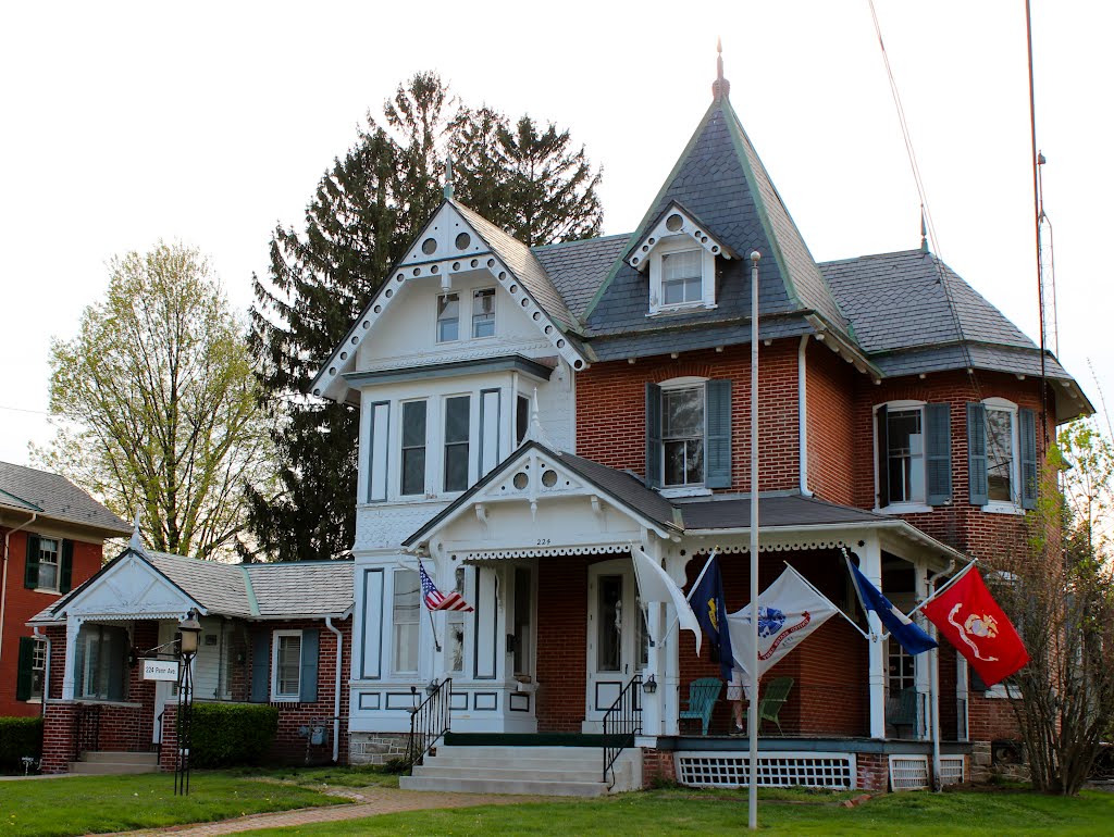 Patriot dad(on porch) holding the US Army flag, with children in different branches of the service by gene.alderson