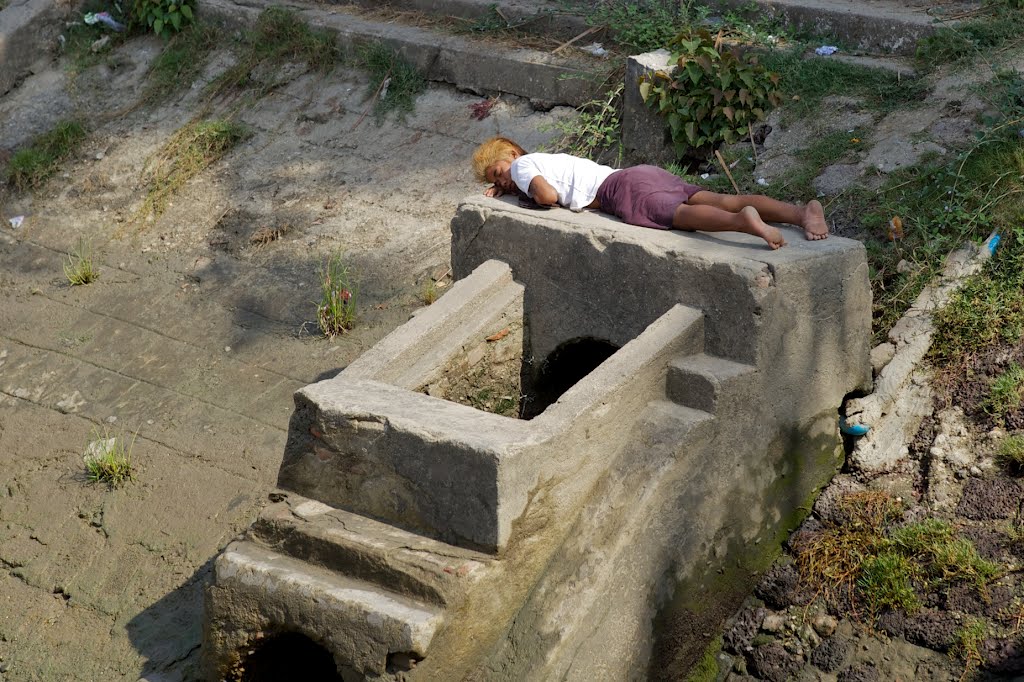 Sleeping near Pansodan Ferry, Yangon. Myanmar by Alex Bunjes