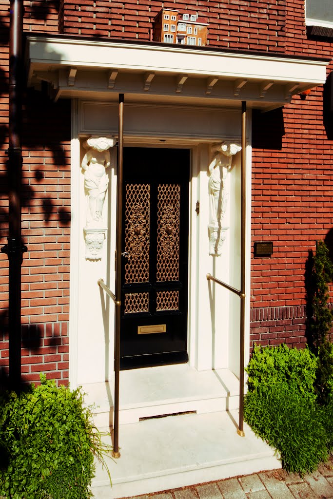 Nice birdhouse above front door by a77ard