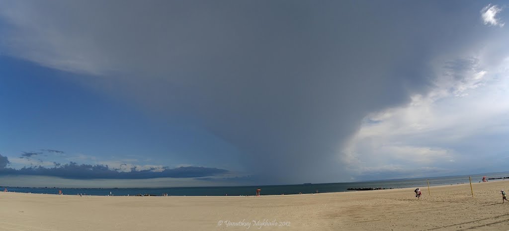 Rainy clouds over ocean by Mykhailo Yanytskuy