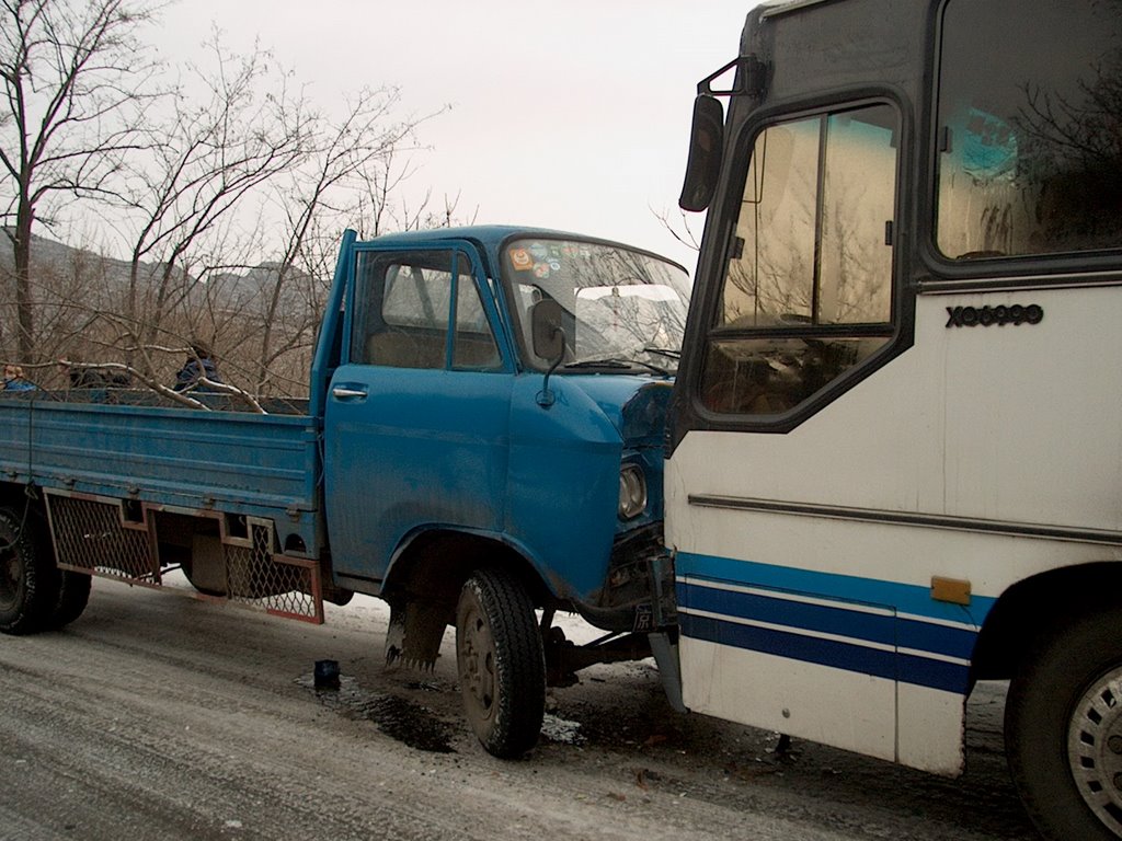 Bus and truck meeting on the iced road by flyover