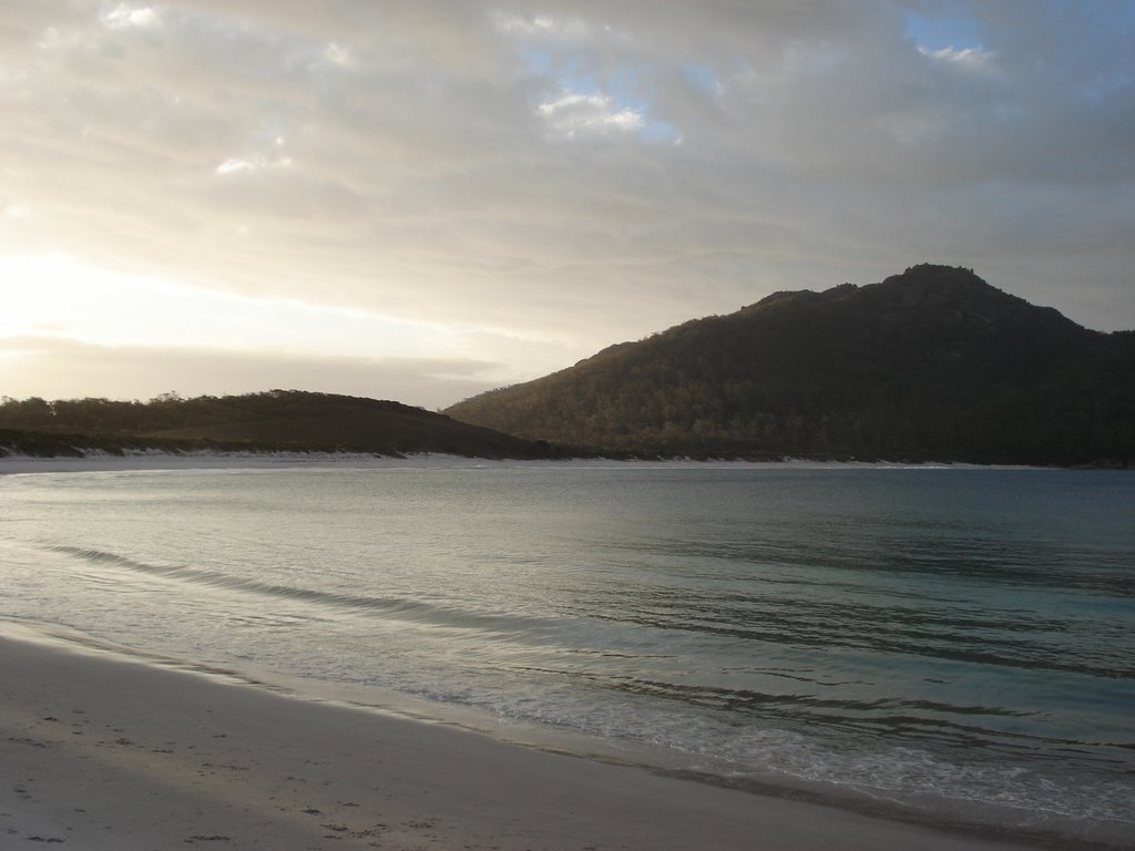 Soft sound of the small waves lapping up the beach by Glen Ward