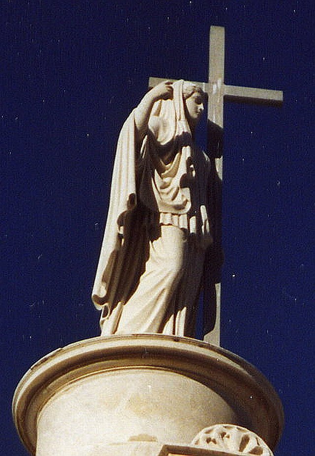 Statue crowning Italian Mutual Benevolent Society Tomb in St. Louis Cemetary #1, New Orleans by mlhess