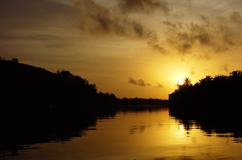 A Smoky Sunset on the Swarna River by praveenjoseph