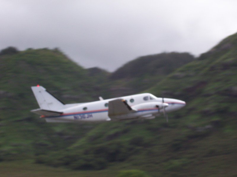 A King Air with a full load of skydivers takes off by X-rayLima