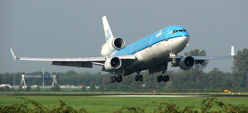 KLM MD-11 touching down on runway 18R (Polderbaan) by PaulFvS