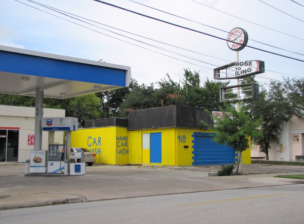 Colorful car wash with amateurish signage by Wolfgang Houston