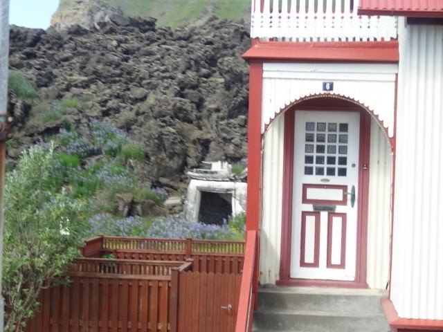 BEHIND THERE IS A HOUSE COMPLETELY BURIED BY THE LAVA OF ELDFELL VOLCANO, in VESTMANNAEYJAR TOWN, THE POMPEY OF THE NORTH -VESTMANNAEYJAR ISLANDS - ISLAND by Ana F. S. Galvão