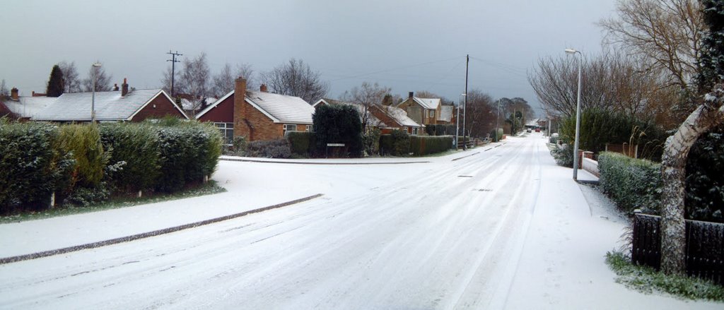 Crowle Village in the Snow by Raymond J Brotherton